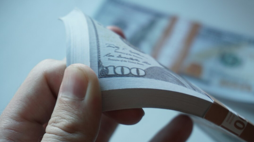 Journalist annotating a financial document